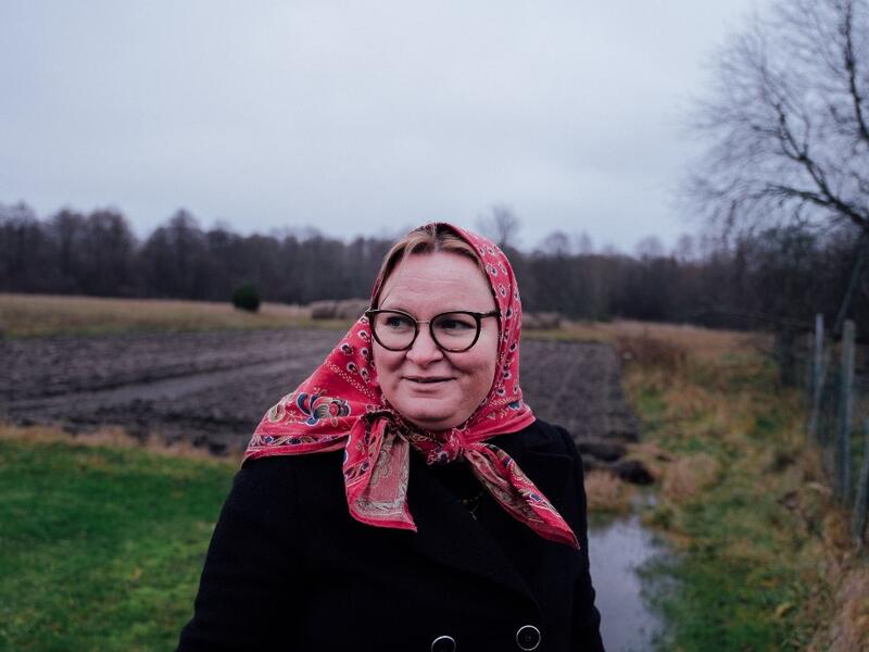 Mare Mätas, local tour guide, answers journalists' questions on November 20, 2019 on Kihnu island in the Baltic Sea, 10 kilometres (six miles) off the coast of Estonia. Steeped in folk traditions, Kihnu's historic way of life however is now threatened as economic hardship drives more and more islanders away in search of work. Alessandro RAMPAZZO / AFP
