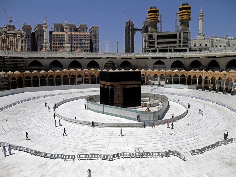 Muslim worshippers circumambulate the sacred Kaaba in Mecca's Grand Mosque, Islam's holiest site, on April 3, 2020. Saudi Arabia on April 2 extended curfew restrictions on Islam's two holiest cities to 24 hours to stem the spread of coronavirus as the number of deaths from the disease rose to 21. AFP