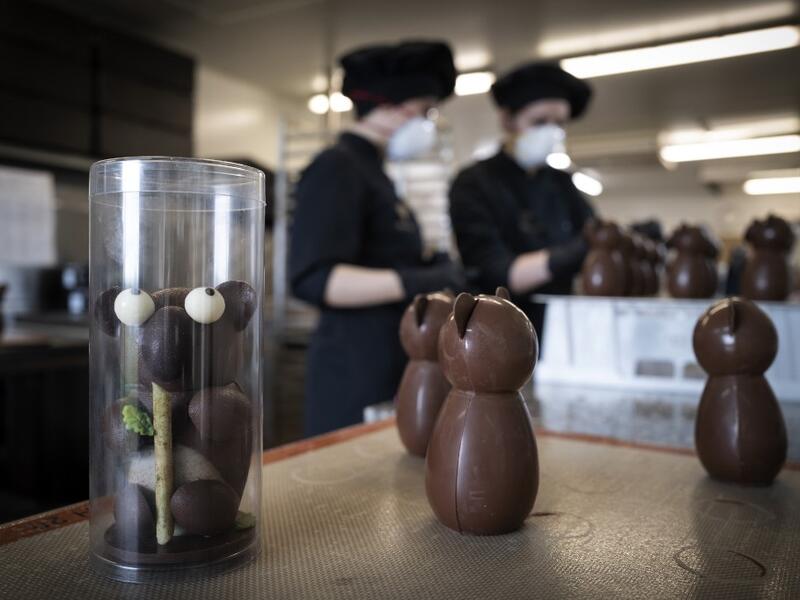 Employees work in the laboratory of the of the Criollo chocolate factory as they prepare chocolate for the Easter week, on April 06, 2020 in Saint-Pierre-De-Lages near Toulouse southern France, on the twenty-first day of a strict lockdown in France to stop the spread of COVID-19, caused by the novel coronavirus. Lionel BONAVENTURE / AFP