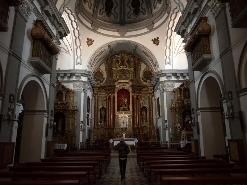 A man visits "Los Descalzos" church in Ronda on April 7, 2020, as Holy Week processions were cancelled during a national lockdown to prevent the spread of the COVID-16 outbreak. AFP
