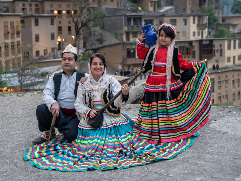Iranian family in Persian traditional clothes at village of Masuleh in Gilan province (Shutterstock)