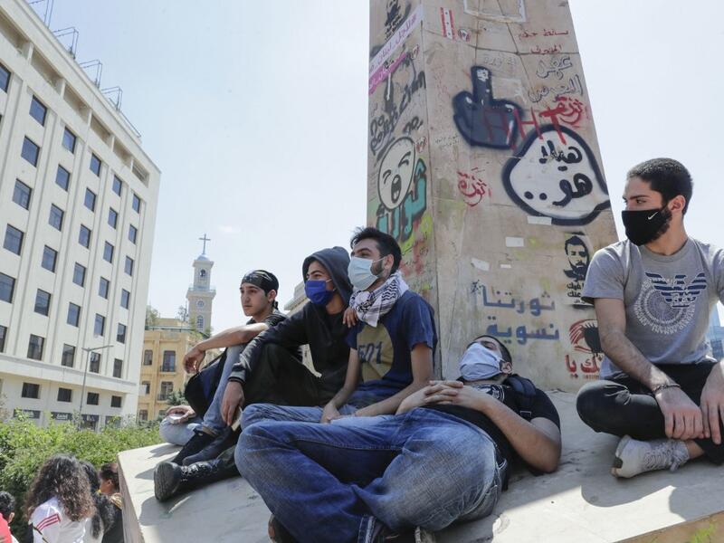 A handout picture released by the official Syrian Arab News Agency (SANA) on May 1, 2020, shows smoke billowing above buildings in Syria's central city of Homs. SANA said that the explosions ringing out of a Syrian army position in Homs resulted from a "human error during the transport of some ammunition, which led to human and material losses", while the Syrian Observatory for Human Rights, a Britain-based war monitor relying on sources inside Syria, said Israeli air strikes hit a missile depot belonging t