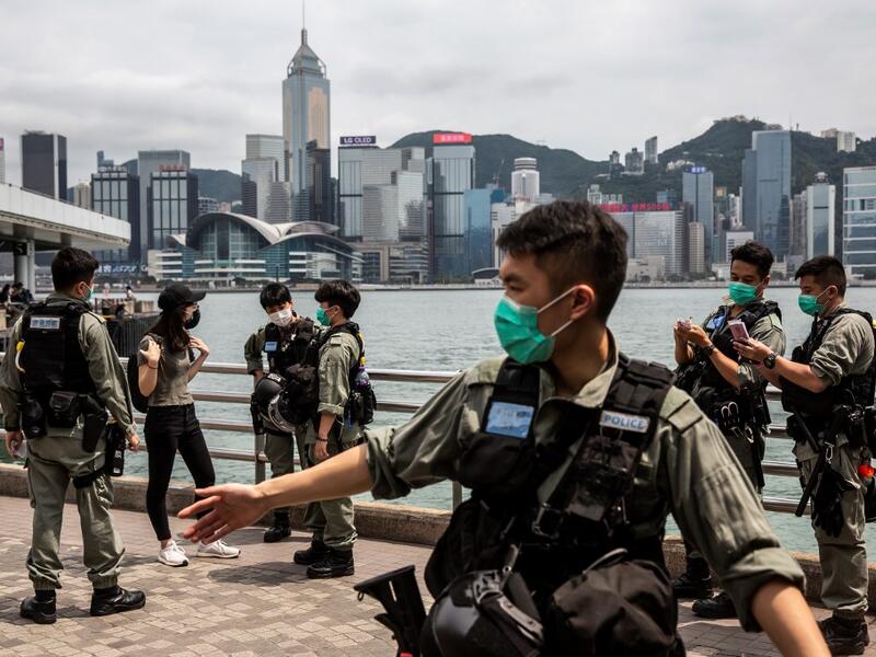 Police officers patrol the Tsim Sha Tsui waterfront where protests by pro-democracy demonstrators calling for the citys independence were scheduled to take place in Hong Kong on May 10, 2020. ISAAC LAWRENCE / AFP