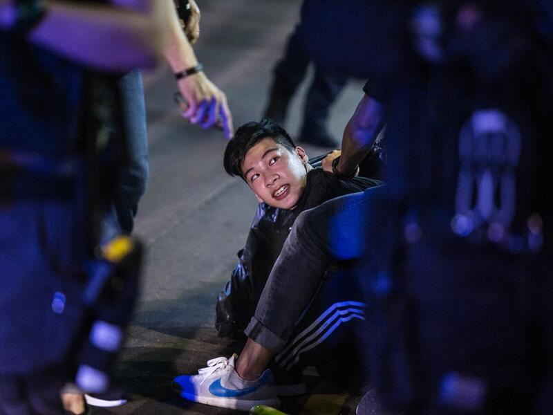 Undercover police arrest a pro-democracy demonstrator (C) during a pro-democracy protest calling for the city's independence in Mong Kok district of Hong Kong on May 10, 2020. ISAAC LAWRENCE / AFP