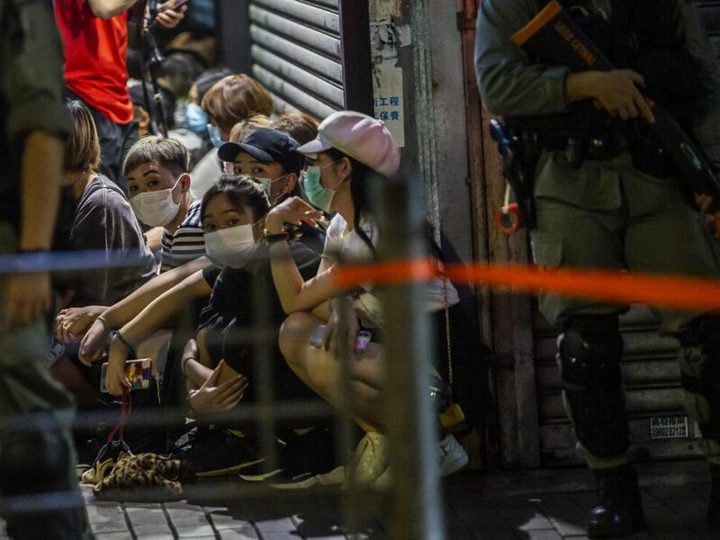 Police detain a group of people during a pro-democracy protest calling for the city's independence in Hong Kong on May 10, 2020. ISAAC LAWRENCE / AFP