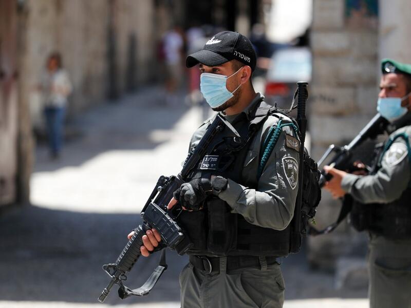 Member of the Israeli security forces patrol in the area where Israeli police in annexed east Jerusalem reportedly shot dead a Palestinian with special needs they mistakenly thought was armed with a pistol, on May 30, 2020. The incident happened in the alleys of the walled Old City near Lions' Gate, an access point mainly used by Palestinians. Ahmad GHARABLI / AFP