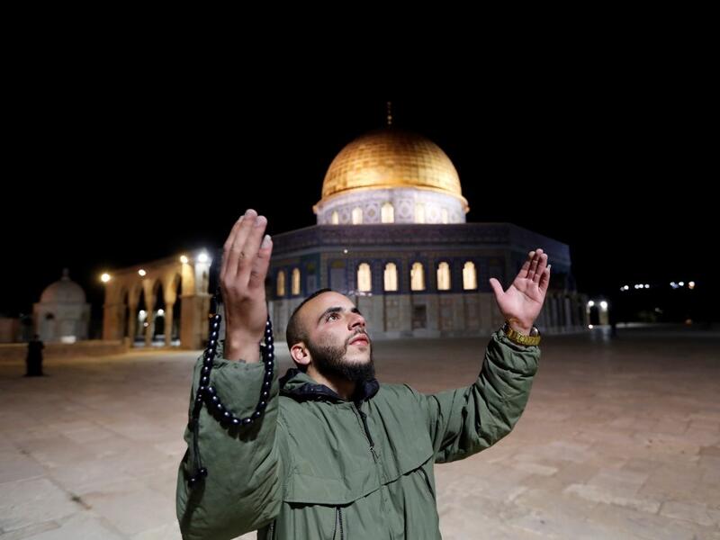 A Palestinian man prays in front of the Dome of the Rock at the al-Aqsa mosque compound, in Jerusalem's Old City on May 31, 2020, after a two-month closure due to the COVID-19 pandemic. Ahmad GHARABLI / AFP