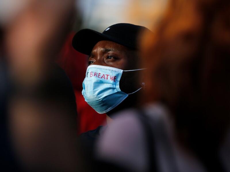 People take part in a protest over the police killing of George Floyd in the USA, on June 1, 2020 in Barcelona. The United States has erupted into days and nights of protests, violence, and looting, following the death of George Floyd after he was detained and held down by a knee to his neck, dying shortly after. Pau Barrena / AFP