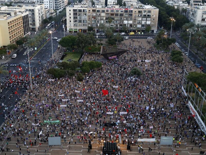 Protesters gather in Tel Aviv's Rabin Square on June 6, 2020, to denounce Israel's plan to annex parts of the occupied West Bank. Israeli Prime Minister Benjamin Netanyahu has vowed to forge ahead with annexing settlements and the Jordan Valley, in line with the peace proposals unveiled in January by US President Donald Trump. The plan has been angrily rejected by the Palestinians, who say they were not consulted on proposals they see as capitulating to Israeli demands. JACK GUEZ / AFP