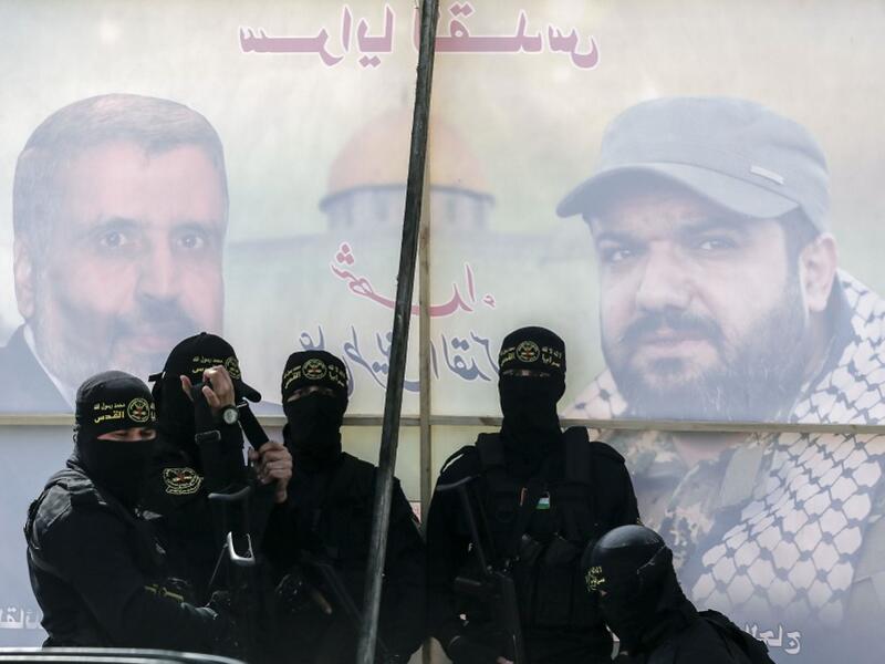 A member of the Palestinian Islamic Jihad group take part in a symbolic funeral for the movement's former leader Ramadan Shalah in Gaza city, on June 7, 2020, a day after he died in neighbouring Lebanon. The 62-year-old died in a Beirut hospital after a long illness, before his body was transported to neighbouring Syria, a Palestinian source said. MAHMUD HAMS / AFP