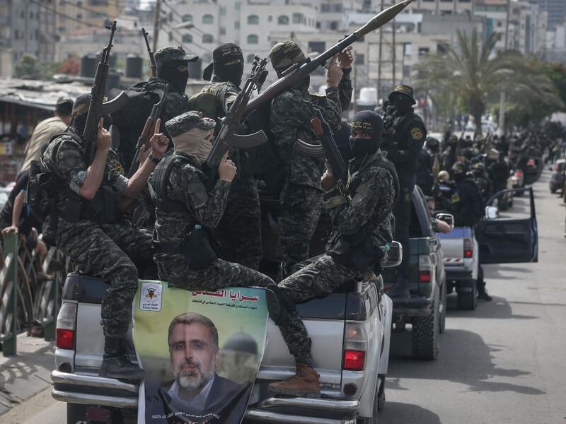 Members of the Palestinian Islamic Jihad group take part in a symbolic funeral for the movement's former leader Ramadan Shalah in Gaza city, on June 7, 2020, a day after he died in neighbouring Lebanon. The 62-year-old died in a Beirut hospital after a long illness, before his body was transported to neighbouring Syria, a Palestinian source said. MAHMUD HAMS / AFP