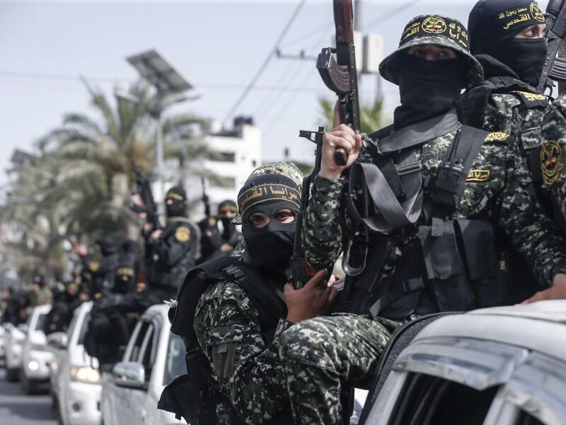 Members of the Palestinian Islamic Jihad militant take part in a symbolic funeral for the movement's former leader Ramadan Shalah in Gaza city, on June 7, 2020, a day after he died in neighbouring Lebanon. The 62-year-old died in a Beirut hospital after a long illness, before his body was transported to neighbouring Syria, a Palestinian source said. MAHMUD HAMS / AFP