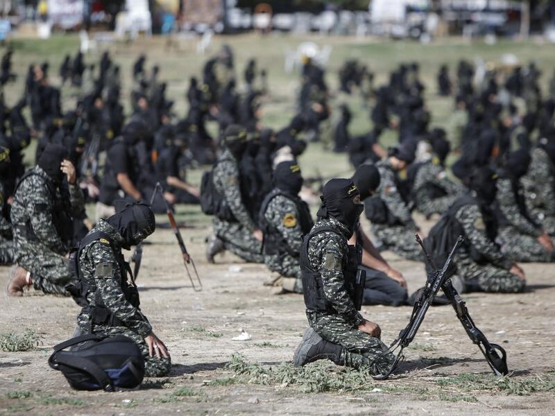 Members of the Palestinian Islamic Jihad group pray ahead of a military parade during a condolence ceremony for the movement's former leader Ramadan Shalah in Gaza city, on June 8, 2020, two days after his death in neighbouring Lebanon. The 62-year-old was buried in Syria on June 7, a day following his death after a long illness. Mohammed ABED / AFP