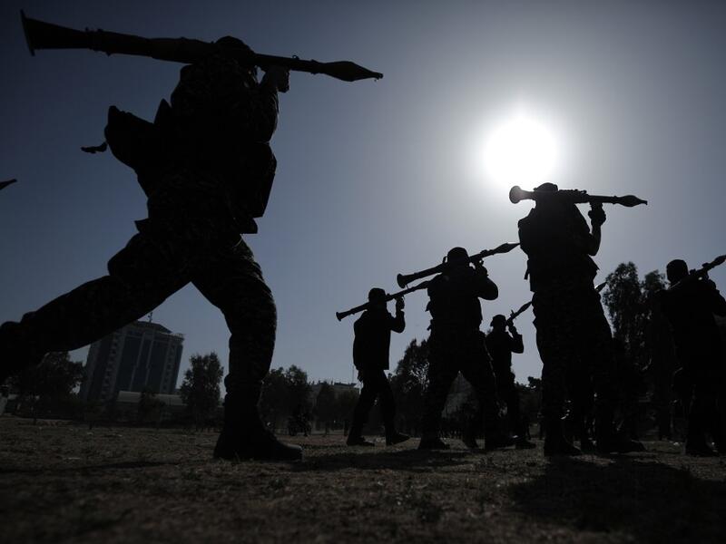 Members of the Palestinian Islamic Jihad group take part in a military parade during a condolences ceremony for the movement's former leader Ramadan Shalah in Gaza city, on June 8, 2020, two days after his death in neighbouring Lebanon. The 62-year-old was buried in Syria on June 7, a day following his death after a long illness. Mohammed ABED / AFP