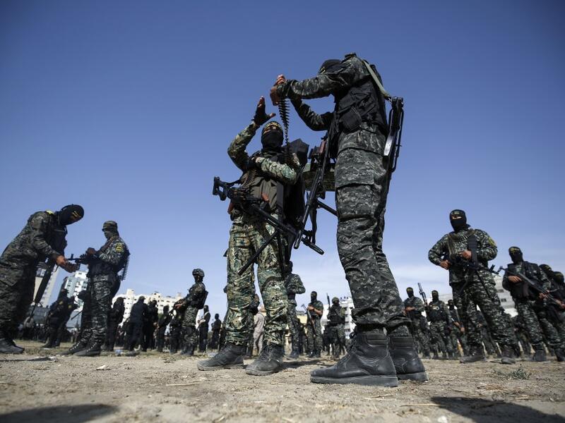 Members of the Palestinian Islamic Jihad group take part in a military parade during a condolence ceremony for the movement's former leader Ramadan Shalah in Gaza city, on June 8, 2020, two days after his death in neighbouring Lebanon. The 62-year-old was buried in Syria on June 7, a day following his death after a long illness. Mohammed ABED / AFP
