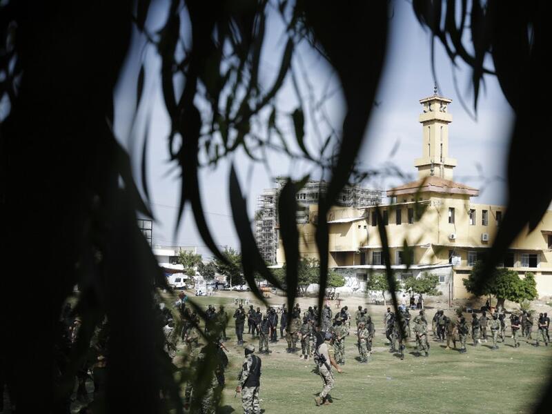 Members of the Palestinian Islamic Jihad group take part in a military parade during a condolences ceremony for the movement's former leader Ramadan Shalah in Gaza city, on June 8, 2020, two days after his death in neighbouring Lebanon. The 62-year-old was buried in Syria on June 7, a day following his death after a long illness. Mohammed ABED / AFP