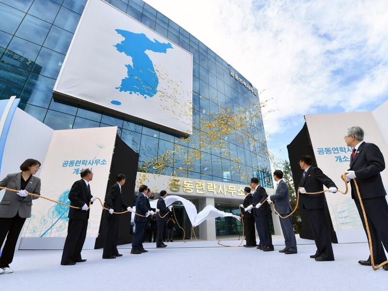 In this file photo taken on September 14, 2018, South and North Korean officials attend an opening ceremony of a joint liaison office in Kaesong. North Korea blew up an inter-Korean liaison office on its side of the border on June 16, 2020, the South's Unification ministry said, after days of increasingly virulent rhetoric from Pyongyang.  KOREA POOL / AFP