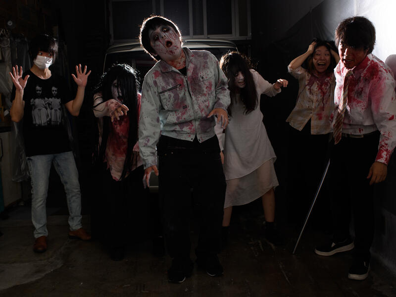 This picture taken on June 15, 2020 shows a group photo of (L-R) sound and lights engineer Daichi Ono, 33, Ayaka Imaide, 34, Kenta Iwana, 25, Haruna Suzuki, 20, Asami Takeuchi, 33, Kota Hanegawa, 28, posing before an interview in a drive-in haunted house in Tokyo. Philip FONG / AFP