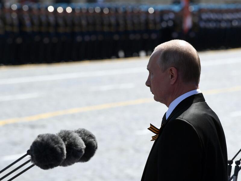 Russian President Vladimir Putin and guests observe a minute of silence during a military parade, which marks the 75th anniversary of the Soviet victory over Nazi Germany in World War Two, at Red Square in Moscow on June 24, 2020. The parade, usually held on May 9, was postponed this year because of the coronavirus pandemic. Alexey NIKOLSKY / SPUTNIK / AFP