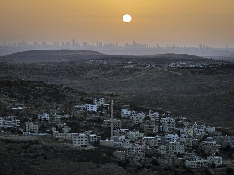 A picture taken from the Israeli settlement of Naale in the occupied West Bank northwest of the Palestinian city of Ramallah shows the skyline of the Israeli coastal city of Tel Aviv on June 17, 2020. The government of Israeli Prime Minister Benjamin Netanyahu has said it could begin the process to annex Jewish settlements in the West Bank as well as the strategic Jordan Valley from July 1. The plan -- endorsed by Washington -- would see the creation of a Palestinian state, but on reduced territory, and wit