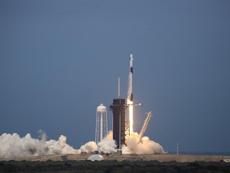 The SpaceX Falcon 9 rocket launches into space with NASA astronauts Bob Behnken (R) and Doug Hurley aboard the rocket from the Kennedy Space Center on May 30, 2020 in Cape Canaveral, Florida. The inaugural flight is the first manned mission since the end of the Space Shuttle program in 2011 to be launched into space from the United States. Saul Martinez/Getty Images/AFP 