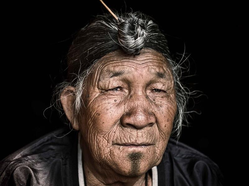 The travel photographer travelled deep into the heart of mountainous Nagaland, India, to capture the striking images. The man above wears a jacket as his long, grey hair is pulled into a bun sitting at the top of his head. (Mediadrumimages/ Trevor Cole)