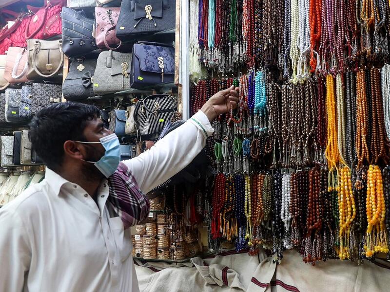 A man checks prayers beads in the holy city of Mecca on June 27, 2020. This year's hajj, which has been scaled back dramatically to include only around 1,000 Muslim pilgrims as Saudi Arabia battles a coronavirus surge, will begin on July 29, authorities said. Some 2.5 million people from all over the world usually participate in the ritual that takes place over several days, centered on the holy city of Mecca.  AFP