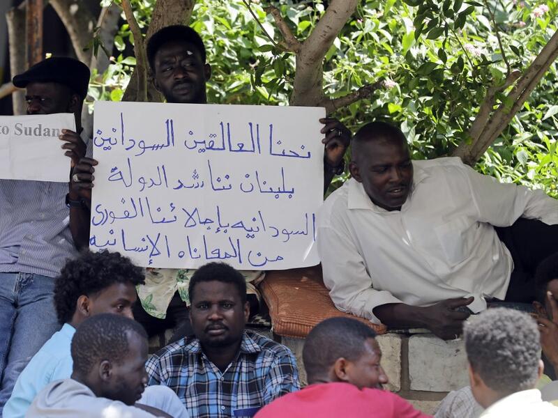 Sudanese workers, who lost their jobs due to the deteriorating economic situation in Lebanon, protest outside their county's embassy in Beirut to demand repatriation, on July 2, 2020. JOSEPH EID / AFP
