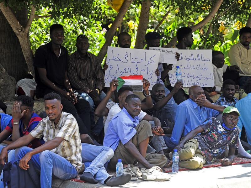 Sudanese workers, who lost their jobs due to the deteriorating economic situation in Lebanon, protest outside their county's embassy in Beirut to demand repatriation, on July 2, 2020. JOSEPH EID / AFP