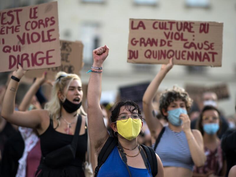 A protester holds their fist up during a demonstration called by feminist movements in Nantes, western France, on July 10, 2020, to denounce the nomination of French Interior Minister, facing rape accusations and French Justice Minister who criticised the #MeToo movement against sexual harassment. LOIC VENANCE / AFP