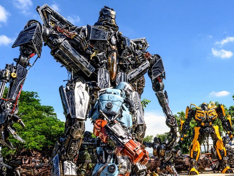 This photograph taken on July 18, 2020 shows life-sized sculptures of characters from the "Transformers" film franchise made of scrap metal parts at the Ban Hun Lek museum in Ang Thong, some 100km north of Bangkok. "Ban Hun Lek" or "The House of Steel Robots" is a museum where a collective of artists display their scrap metal creations depicting popular comics and sci-fi film characters. Mladen ANTONOV / AFP