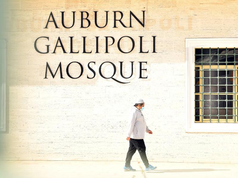 A Muslim worshipper leaves Auburn Gallipoli Mosque after mass Friday prayer on the first day of the Eid al-Adha festival in Sydney on July 31, 2020. Muslims in Australia offered their Eid Al-Adha and Friday prayers inside the mosques with limitations and restrictions to halt the spread of the COVID-19 coronavirus as the country recorded over 16,000 coronavirus cases and 189 deaths in a population of 25 million. SAEED KHAN / AFP