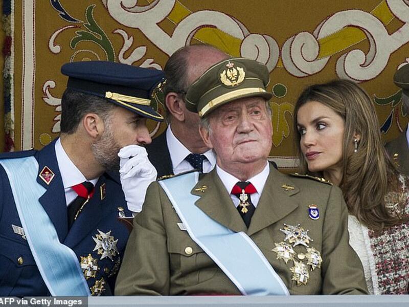 King Felipe pictured with former king Juan Carlos and Spain's Queen Letizia at the Spanish National day military parade in Madrid on October 12, 2012. (AFP)