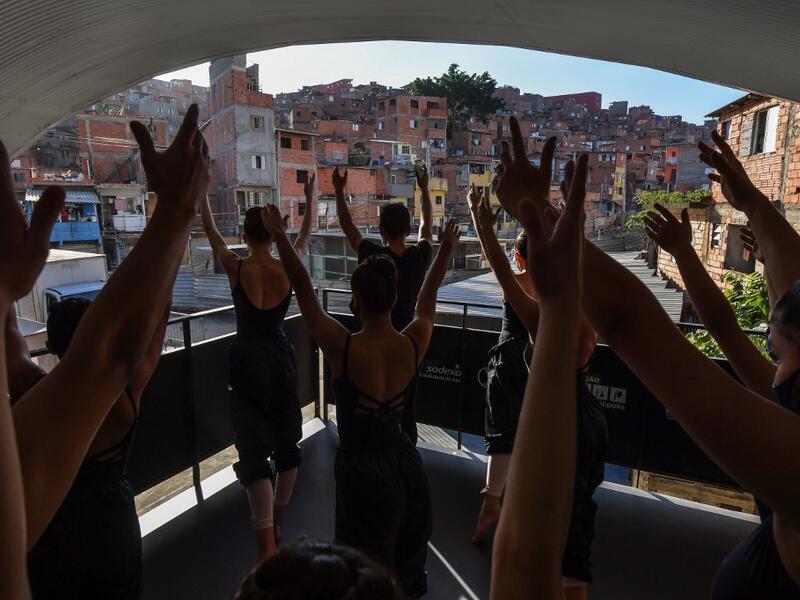 Ballet Paraisopolis students rehearse in Paraisopolis favela, outskirts of Sao Paulo, Brazil on August 27, 2020, amid the new coronavirus COVID-19 pandemic. The 200 ballet students of Paraisopolis, the second largest favela in Sao Paulo, restarted rehearsals after five months with a coreography about a police operation that put their community in mourning last year. NELSON ALMEIDA / AFP