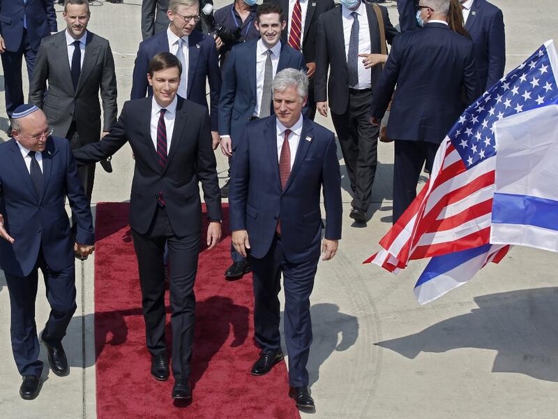 US Presidential Adviser Jared Kushner (C), US National Security Adviser Robert O’Brien (R) and Head of Israel's National Security Council Meir Ben-Shabbat (L) board the El Al's flight LY971, which will carry an Israeli-American delegation from Tel Aviv to Abu Dhabi, at the Ben Gurion Airport near Tel Aviv on August 31, 2020. NIR ELIAS / POOL / AFP