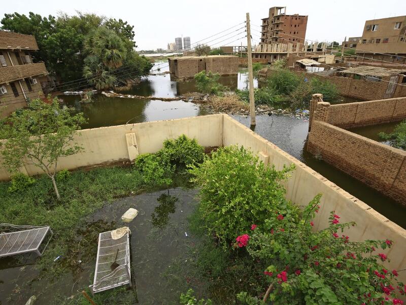 Officials say that across Sudan seasonal floods have killed 94 people, injured 46 and destroyed or damaged over 60,000 homes, with the river level rising to 17.43 metres (57 feet feet). ASHRAF SHAZLY / AFP