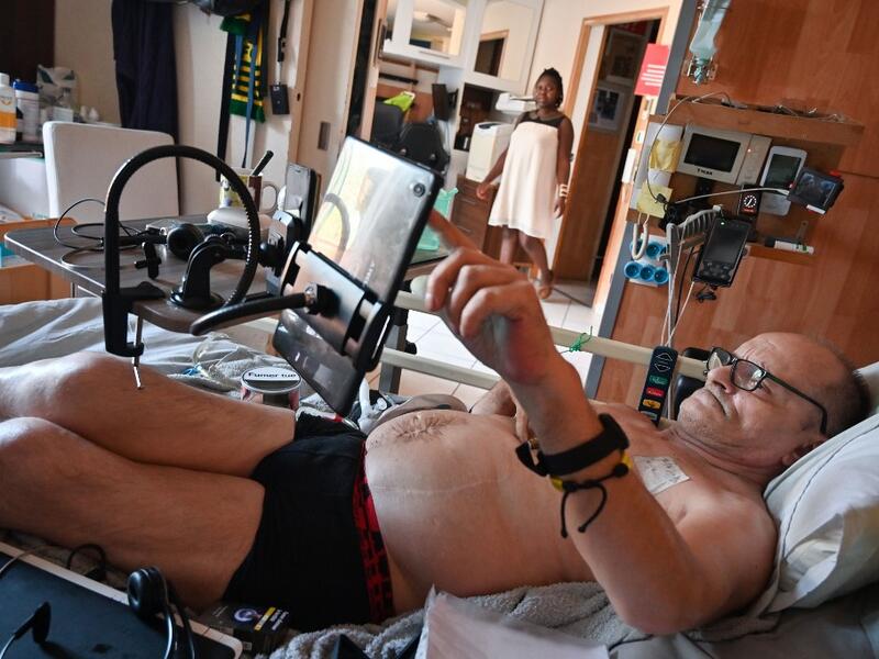 In this file photo taken on August 12, 2020 Alain Cocq, suffering from an orphan desease of the blood, rests on his medical bed in his flat in Dijon, northeastern France. Cocq announced on September 4, 2020 that he had been refused by the French President in his request to help him die and that he will cease all treatment from this day on. (AFP)