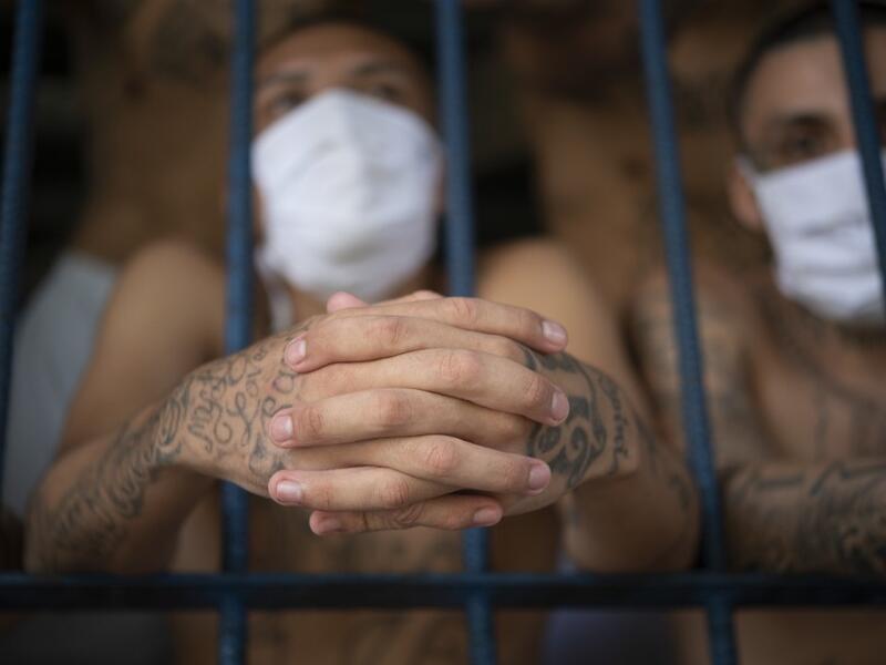 Members of the MS-13 and 18 gangs remain in an overcrowded cell at the Quezaltepeque prison, in Quezaltepeque, El Salvador, on September 4, 2020. Authorities from the General Directorate of Penal Centres (DGCP) visited three Salvadorean prisons, some of maximum security, to check the situation of inmates and carry out searches amid the COVID-19 novel coronavirus pandemic. Yuri CORTEZ / AFP