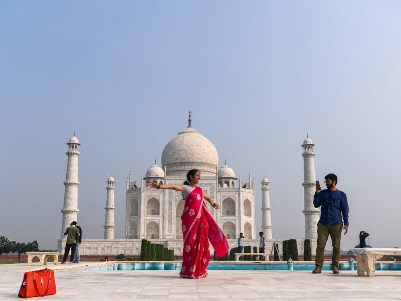 Tourists visit the Taj Mahal in Agra on September 21, 2020. The Taj Mahal reopened to visitors on September 21 in a symbolic business-as-usual gesture even as India looks set to overtake the US as the global leader in coronavirus infections. Sajjad HUSSAIN / AFP