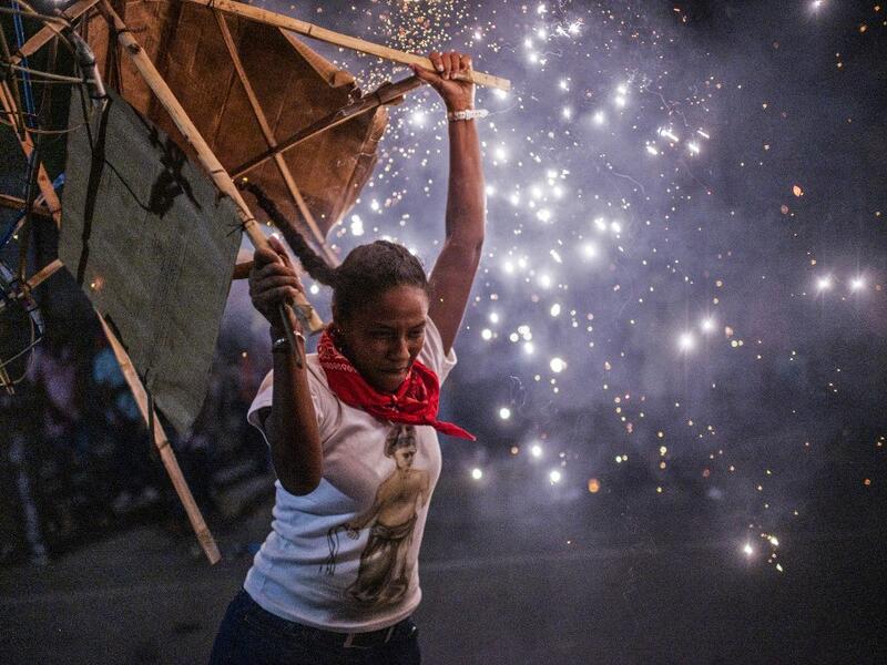 A member of the Afro-Mexican community carries a "toritol" of fire during the annual festival dedicated to San Nicolas Tolentino, in Cuajinicuilapa, Guerrero state, Mexico, on September 9, 2020, amid the COVID-19 coronavirus pandemic. Although there are 1,5 million African descendants in a country of 128 million inhabitants, it is normal to hear that "in Mexico there are no blacks". PEDRO PARDO / AFP