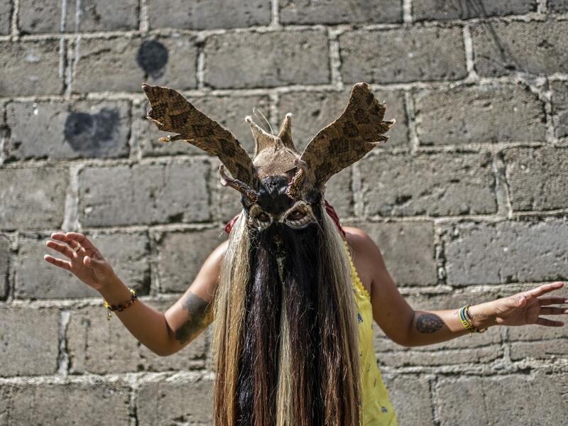 Mijane Jimenez, 31, activist of the Afro-Mexican community, wears a "Diablo" mask in Cuajinicuilapa, Guerrero state, Mexico, on September 10, 2020, amid the COVID-19 coronavirus pandemic. Although there are 1,5 million African descendants in a country of 128 million inhabitants, it is normal to hear that "in Mexico there are no blacks". PEDRO PARDO / AFP