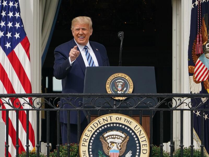 US President Donald Trump greets supporters after speaking about law and order from the South Portico of the White House in Washington, DC, on October 10, 2020. Trump spoke publicly for the first time since testing positive for Covid-19, as he prepares a rapid return to the campaign trail just three weeks before the election. MANDEL NGAN / AFP