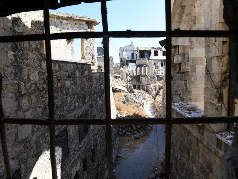Syrian workers take part in the reconstruction of Martini restaurant and hotel in the Jdaideh neighbourhood in Aleppo's Old City on October 17, 2020. AFP