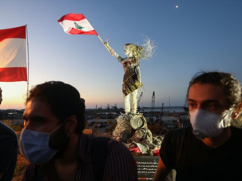 Hundreds marched in Lebanon's capital to mark the first anniversary of a non-sectarian protest movement that has rocked the political elite but has yet to achieve its goal of sweeping reform. ANWAR AMRO / AFP
