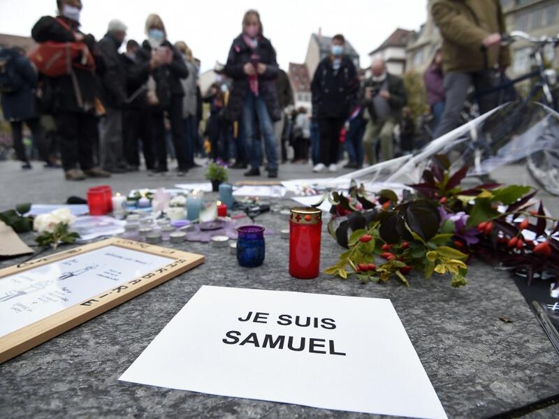 Thousands of people rally in different French cities on October 18 in a show of solidarity and defiance after a teacher was beheaded for showing pupils cartoons of the Prophet Mohammed.  FREDERICK FLORIN / AFP