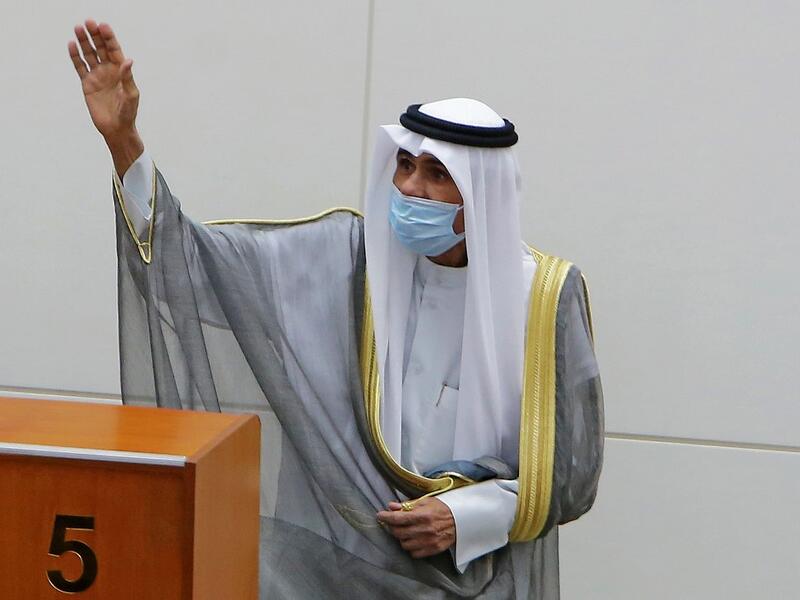 Emir of Kuwait Sheikh Nawaf al-Ahmad al-Jaber al-Sabah gestures in greeting upon arrival to attend the opening of the 5th regular session at the country's National Assembly (parliament) in Kuwait City on October 20, 2020. YASSER AL-ZAYYAT / AFP
