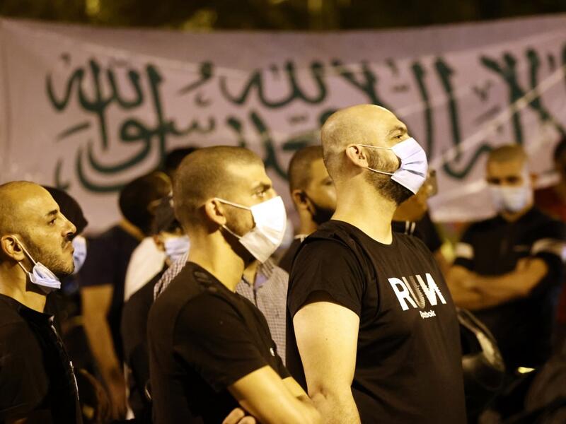 Arab-Israeli protesters gather outside the residence of the French Ambassador to Israel, in Tel Aviv on October 24, 2020, in response to comments by French President Emmanuel Macron defending cartoons of the Prophet Mohammed. JACK GUEZ / AFP