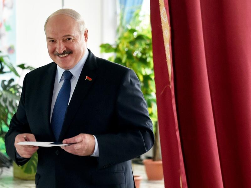 Belarus' President Alexander Lukashenko votes at a polling station during the presidential election in Minsk on Sunday. Photo: AFP