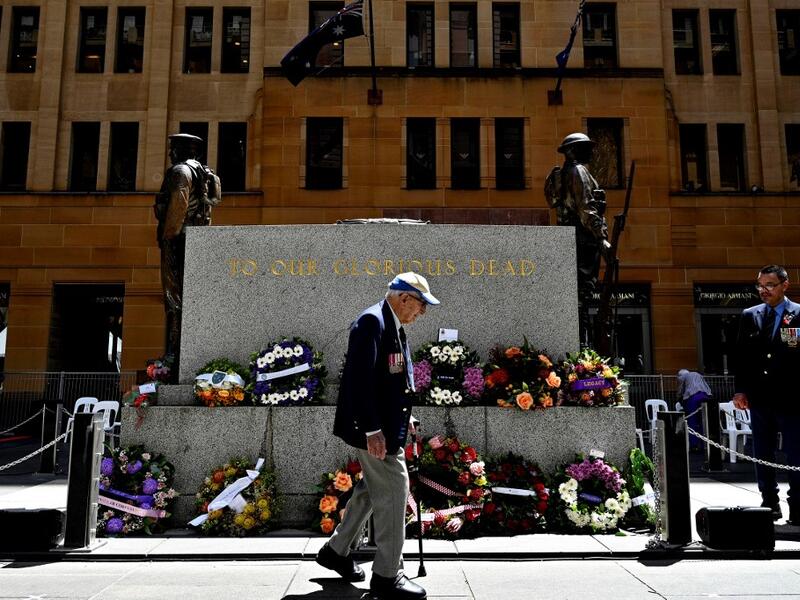 An elderly man walks past The Cenotaph monument after the Remembrance Day Service to mark the anniversary of the end of World War I, at Martin Place in Sydney on November 11, 2020. Saeed KHAN / POOL / AFP