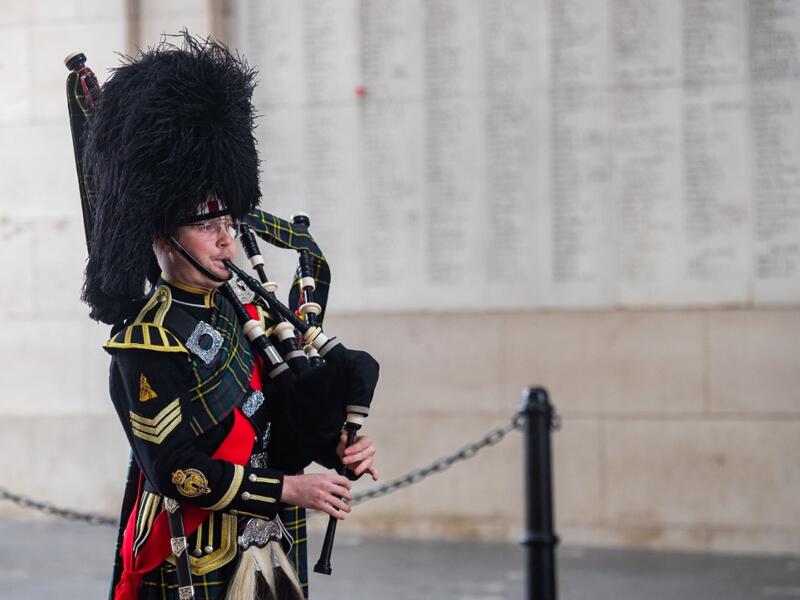 Belgian piper Gil Vermeulen plays the pipes during the Last Post ceremony at the Commonwealth War Graves Commission Ypres Memorial at the Menin Gate in Ypres on November 11, 2020 on the occasion of the commemorations marking the 102nd anniversary of the November 11, 1918 Armistice, ending World War I (WWI). Kurt DESPLENTER / BELGA / AFP